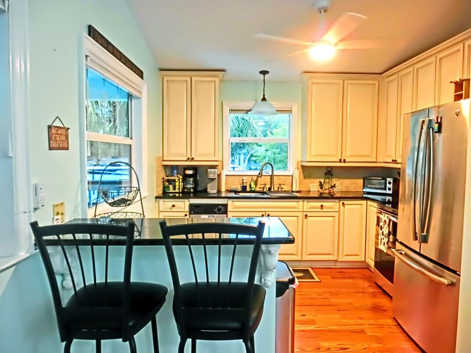Efficient kitchen, overlooking the water, with all the basics