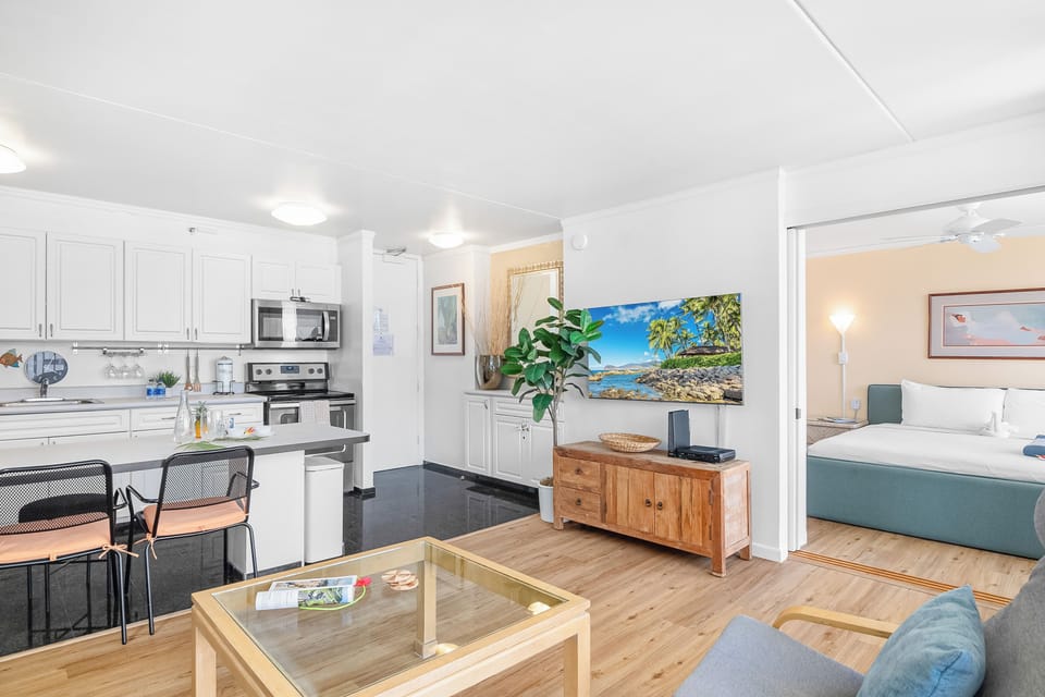 Enjoy watching movies in your living area with a flat-screen TV, pull-out sleeper sofa, armchairs, and a coffee table.