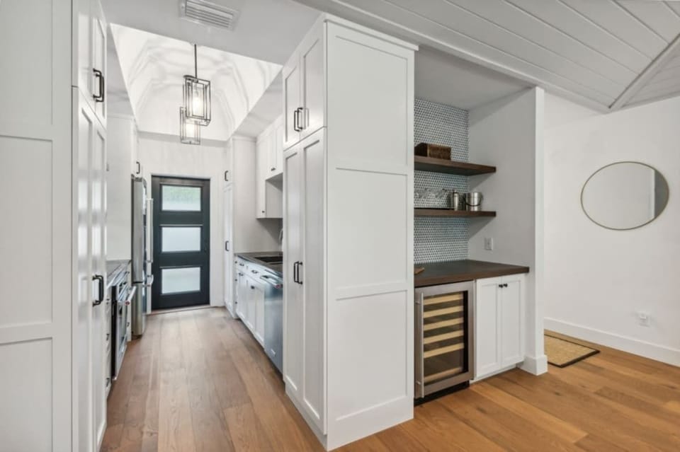 Kitchen view as you enter - door leads to fenced private courtyard