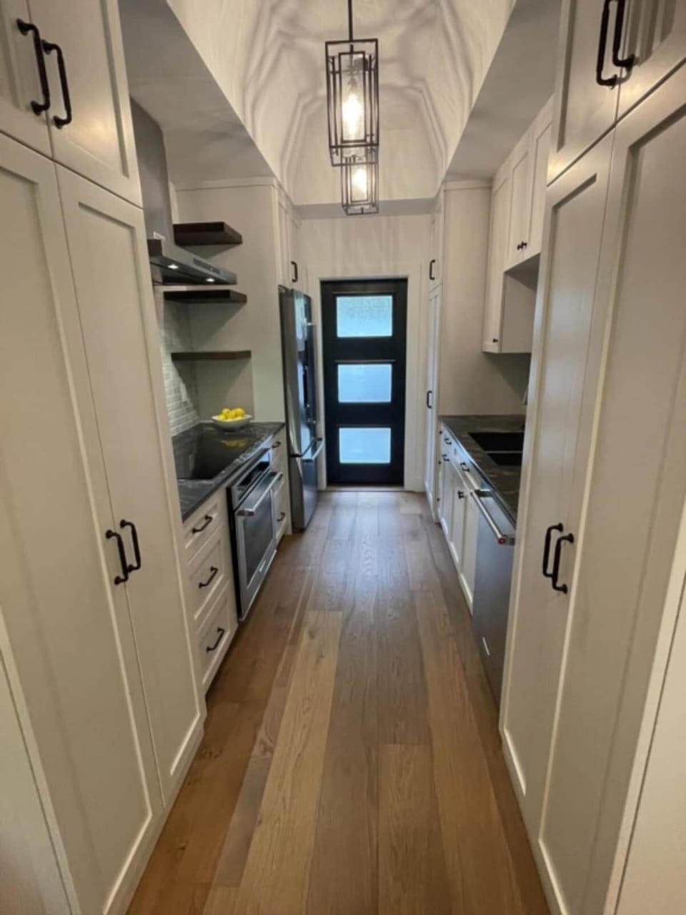 Kitchen and entry door to private, fenced courtyard.