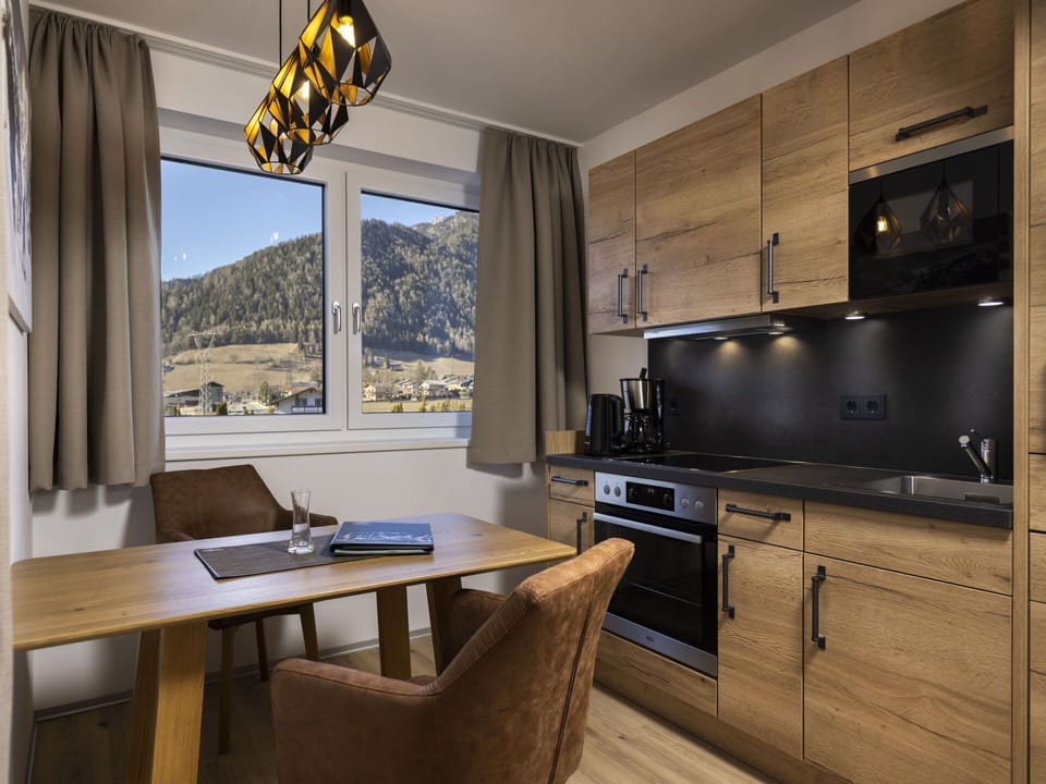 Furniture, Property, Cabinetry, Table, Building, Countertop, Kitchen Stove, Wood, Kitchen Appliance, Window