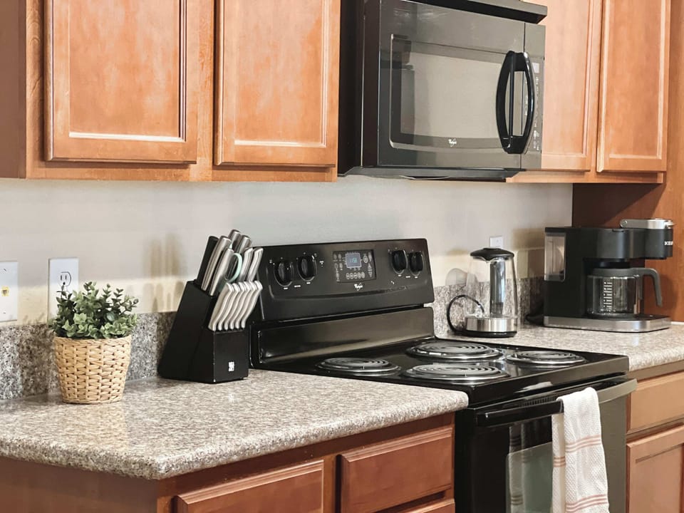 Full kitchen with essentials for coffee, snacks, and easy meals.