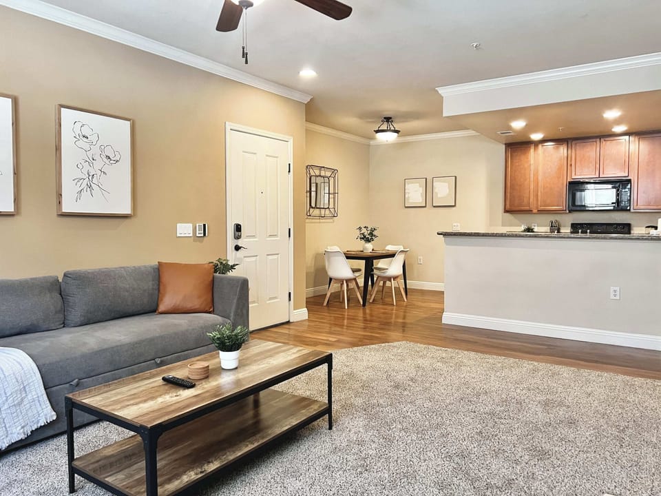 Open living and kitchen area designed for relaxing, dining, and working.