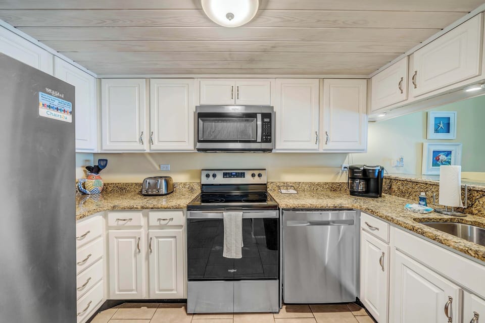The fully equipped kitchen features granite countertops and stainless-steel appliances and has everything you need to prepare meals for family & friends.
