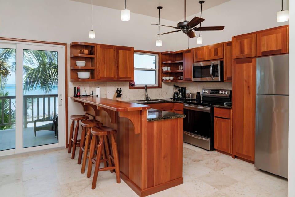 Furnished kitchen with kitchen island bar seating