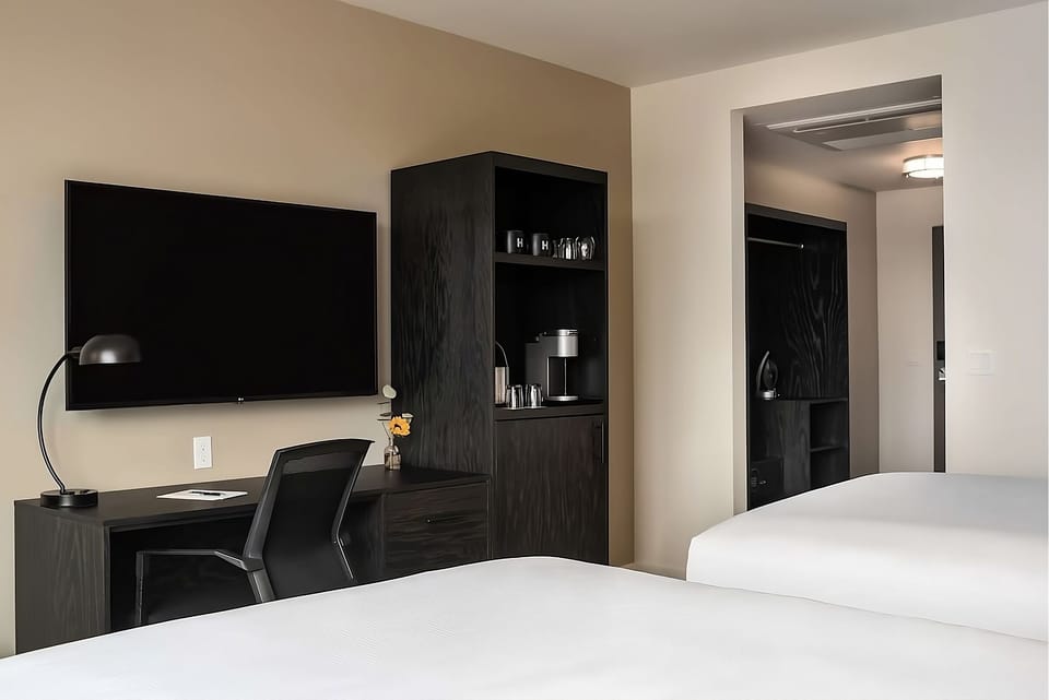 Kick back after meetings with big-screen TV and coffee nook.