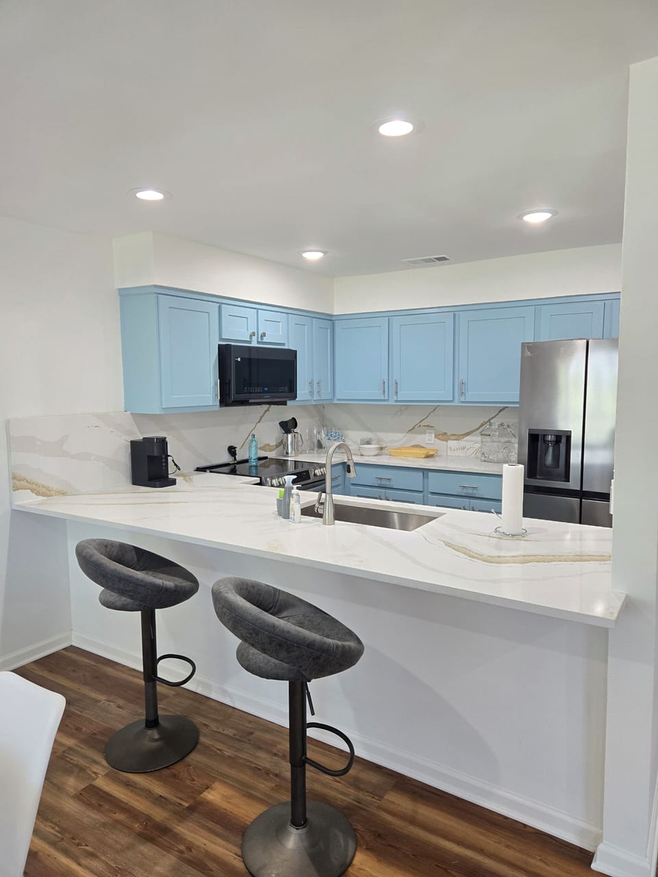 Don't miss a thing!  Kitchen opens to dining and living area.  Seating for 8. 