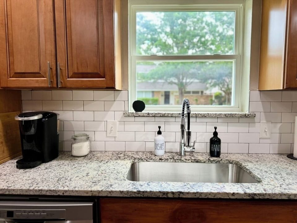 Sink + coffee maker at the kitchen counter