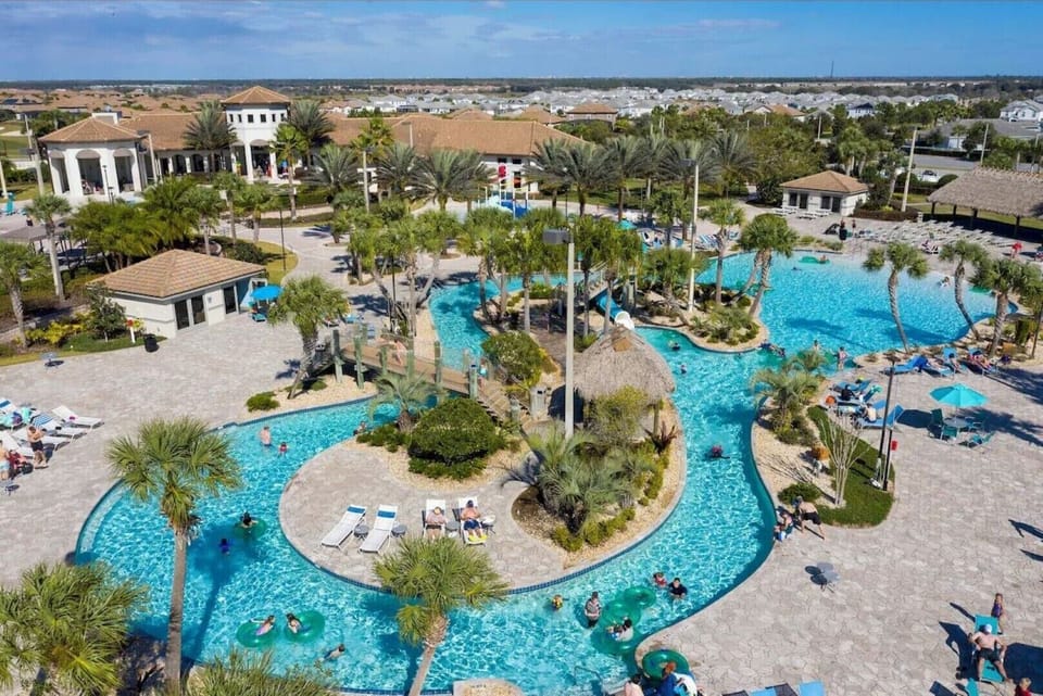 Oasis clubhouse with pool and lazy river, splash pad, bar, restaruant and more!
