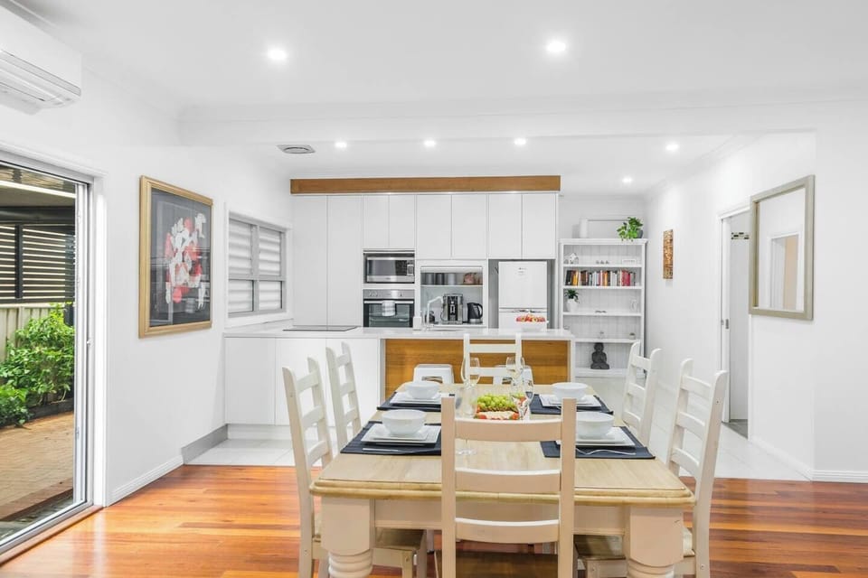 The dining table sits beside the outdoor entrance which conveniently provides a refreshing breeze with your meal or perhaps enjoy setting your desired temperature on the air-conditioning unit. 
