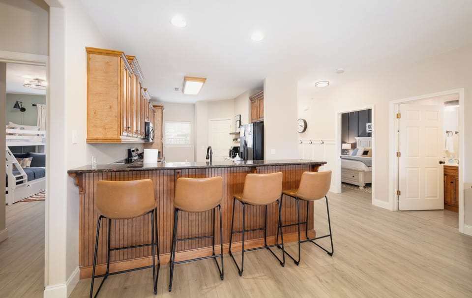 4 Additional Chairs off the Kitchen peninsula.  