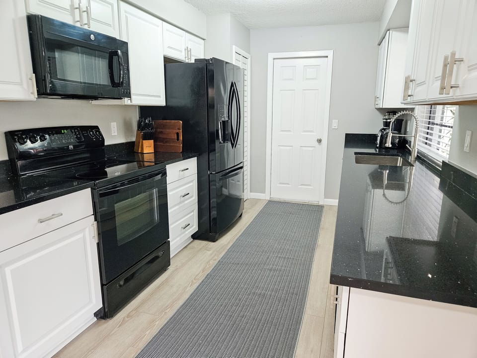 Kitchen Includes Fridge with Ice Maker, Stove, Microwave and Dishwasher