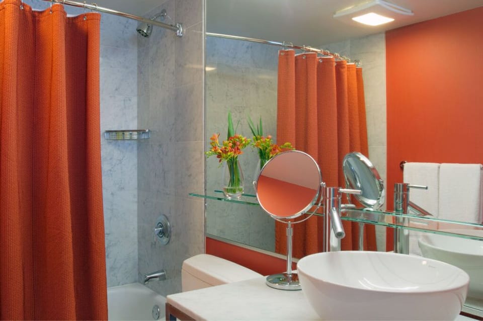 Vibrant and functional bathroom with modern amenities, offering a lively and refreshing environment.