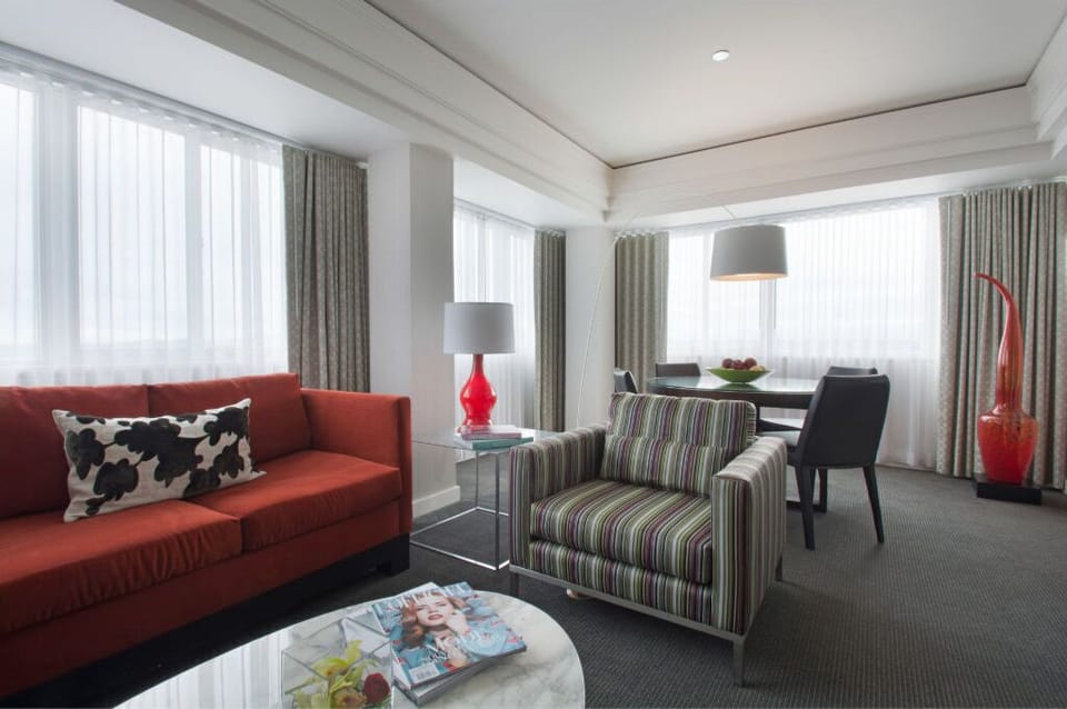Contemporary living space with a vibrant sofa, offering a cozy setting for lounging or entertaining.