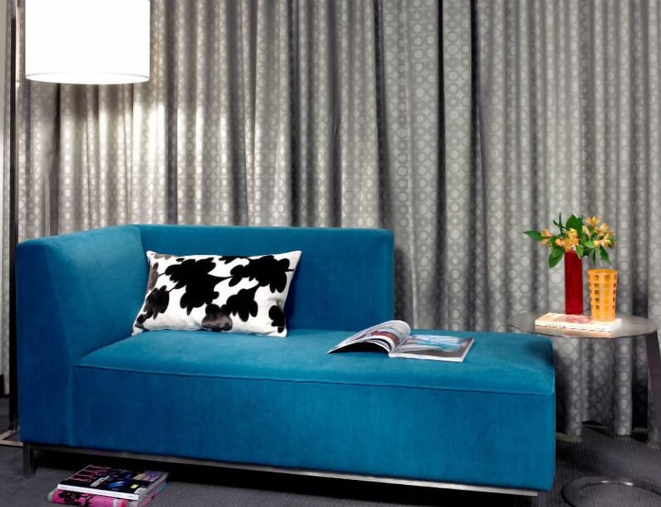 Sleek lounge area outfitted with a modern sofa, creating a chic and comfortable spot for relaxation.