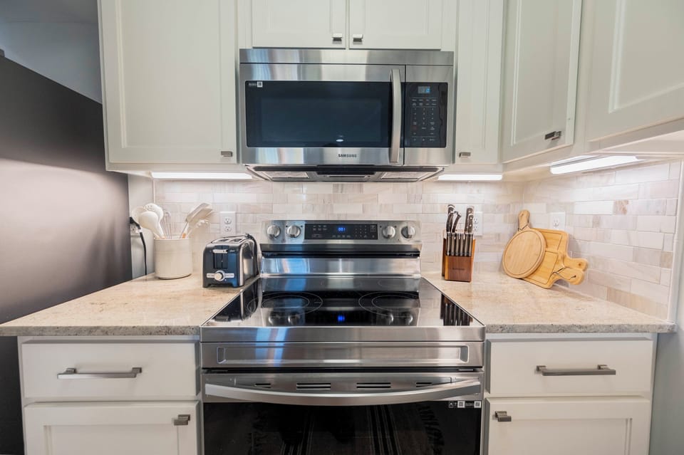 Modern elegance: Sleek kitchen with stainless steel appliances and chic design.