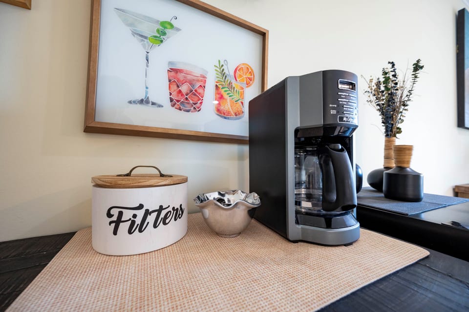 Cozy coffee corner with stylish décor, perfect for morning brews and relaxation.