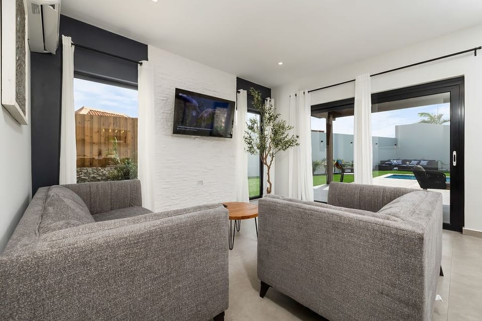 Movie night, anyone? Our living area is the ultimate retreat for cozy evenings in, complete with a comfortable sofa and TV for hours of entertainment.