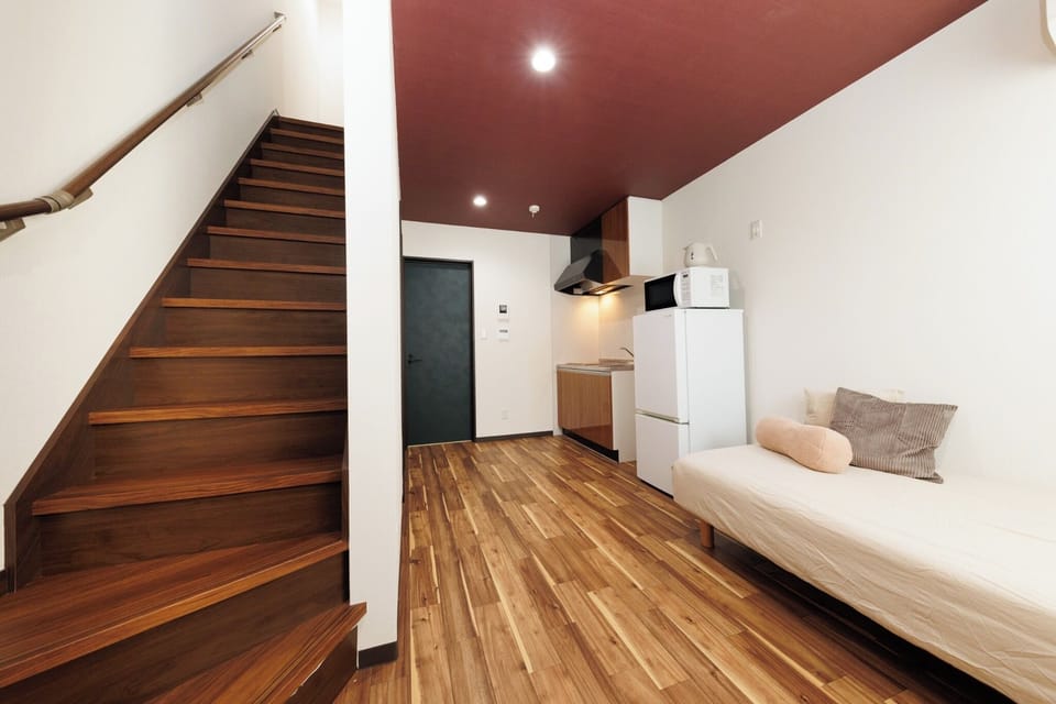 There is a staircase in the living room to go up to the second floor.