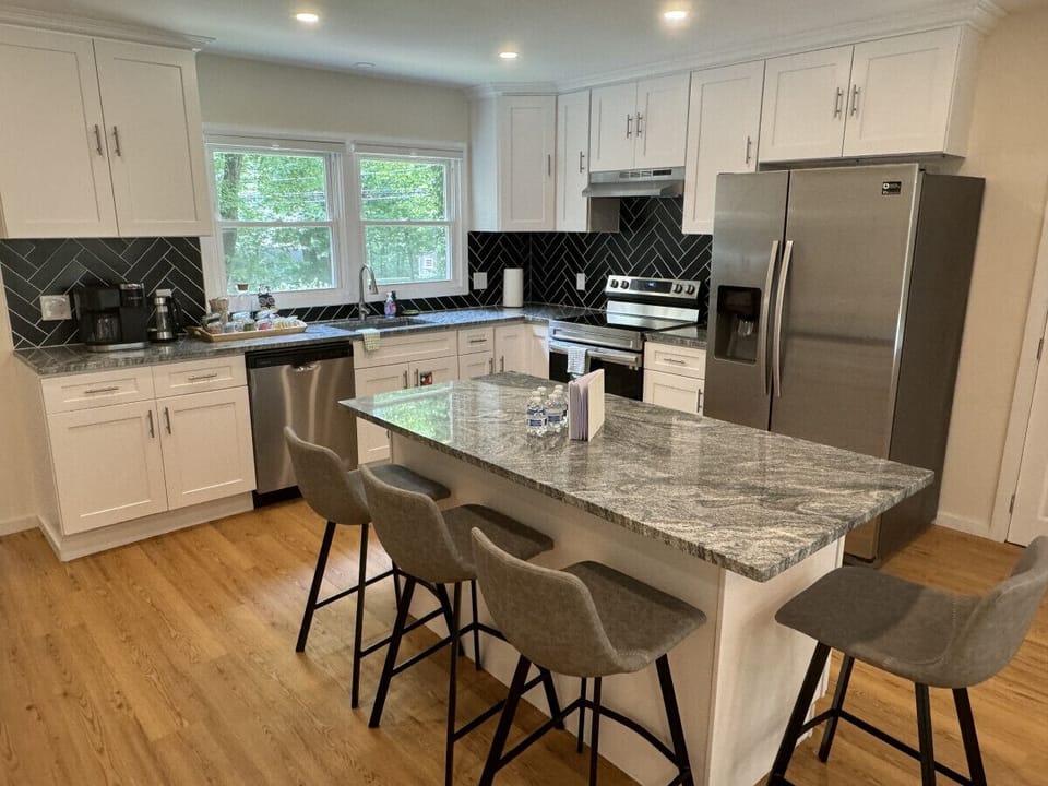 Channel your inner chef in this fully stocked kitchen featuring stainless steel appliances, granite countertops, and all the cookware you need