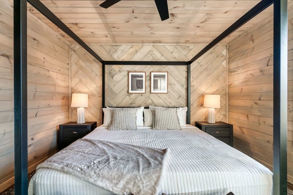 Experience restful nights in a stylish canopy bed with charming decor!