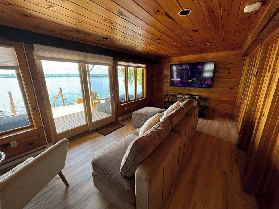 A tranquil reading nook with stunning lake views, ideal for a peaceful moment with a book.
