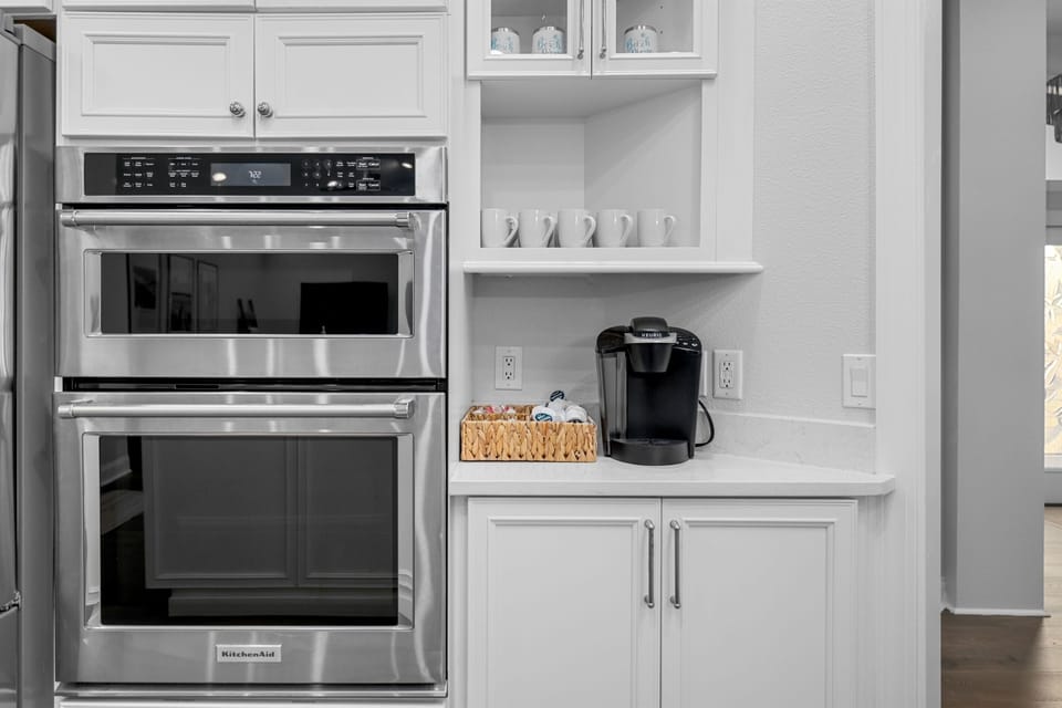 Double ovens and coffee station, fully stocked for everything from morning coffee to family dinners