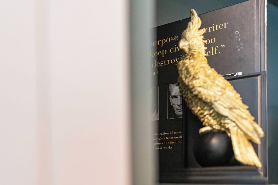 Our decor features a stunning golden bird sculpture that adds artistic flair and warmth to the space, beautifully contrasting with the textured backdrop and creating a unique focal point that sparks conversation.