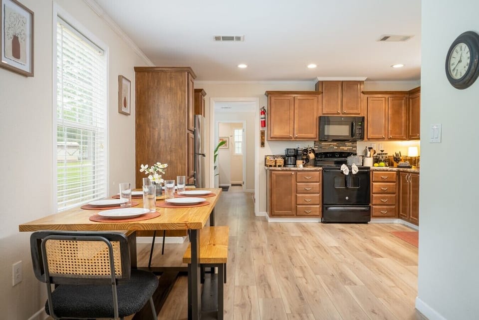 Dining room table with fully stocked kitchen