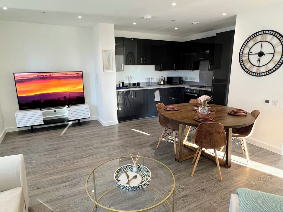 65 inch smart TV, dining area, fully stocked kitchen and appliances