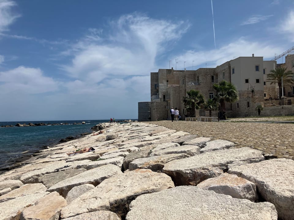 You can walk to the nearest beach on the back of the old Church "Duomo"