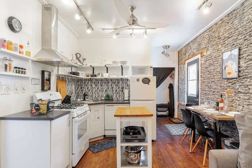 Your home away from home includes a fully equipped kitchen, cozy dining table, and all the touches that make meals memorable.