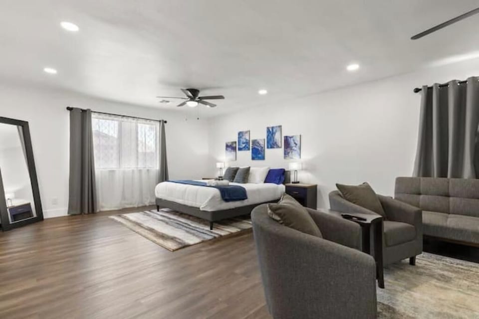 Spacious master suite with cozy seating — the perfect place to unwind.