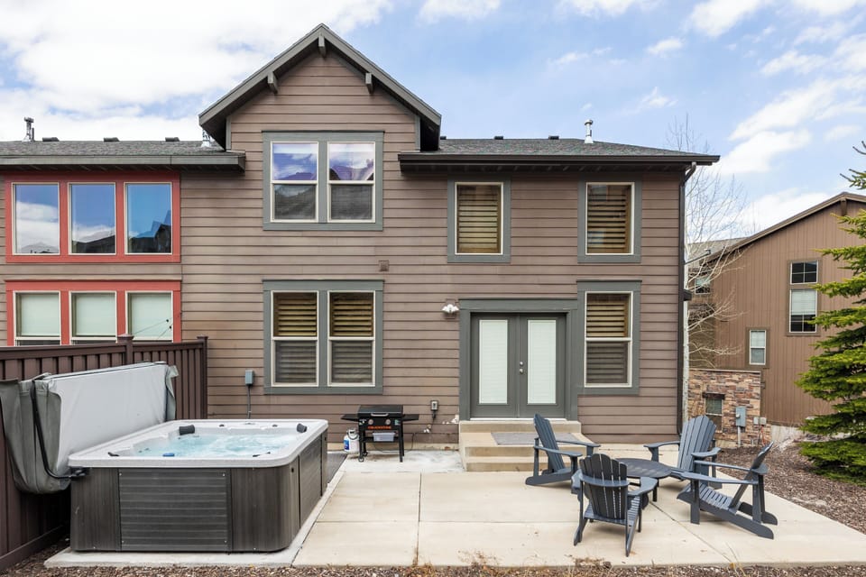 - Step outside to a private patio with hot tub and grill  
- Comfortable Adirondack chairs surround a fire-ready space  
- Relax outdoors after exploring with your group