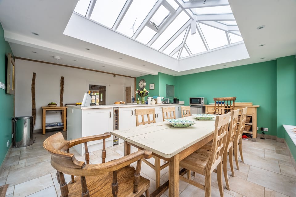 Ground floor: Dining table under the skylight