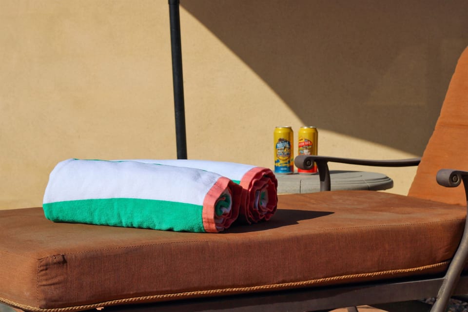 Additional pool seating with umbrella