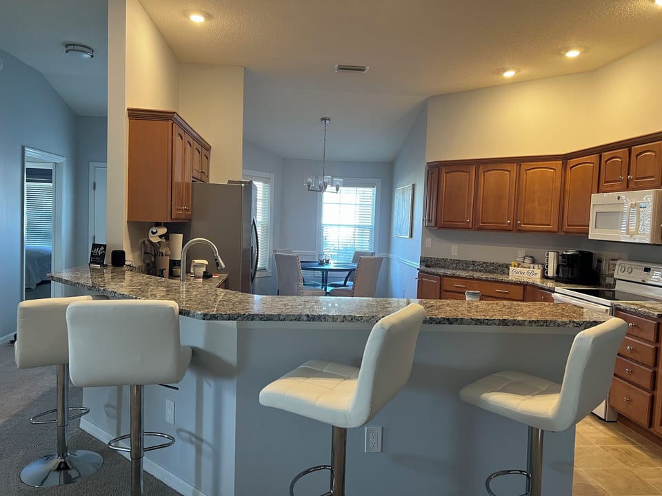 buffet area with 4 swivel bar stools