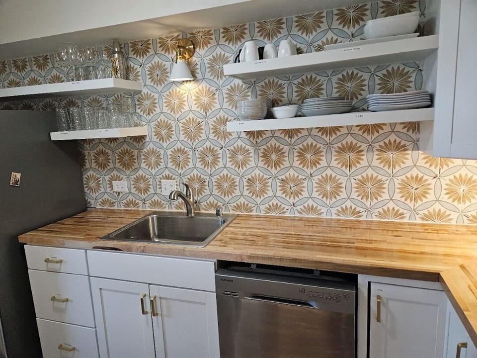 Updated kitchen offers new cabinets and beautiful tile