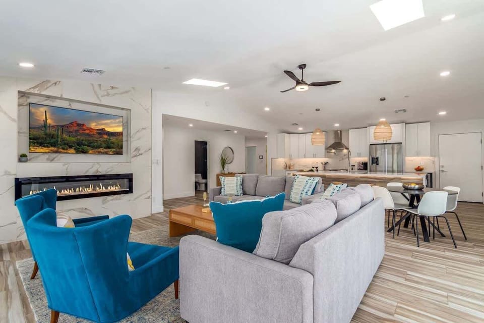 Open concept living space featuring an electric fireplace and a smart TV for entertainment