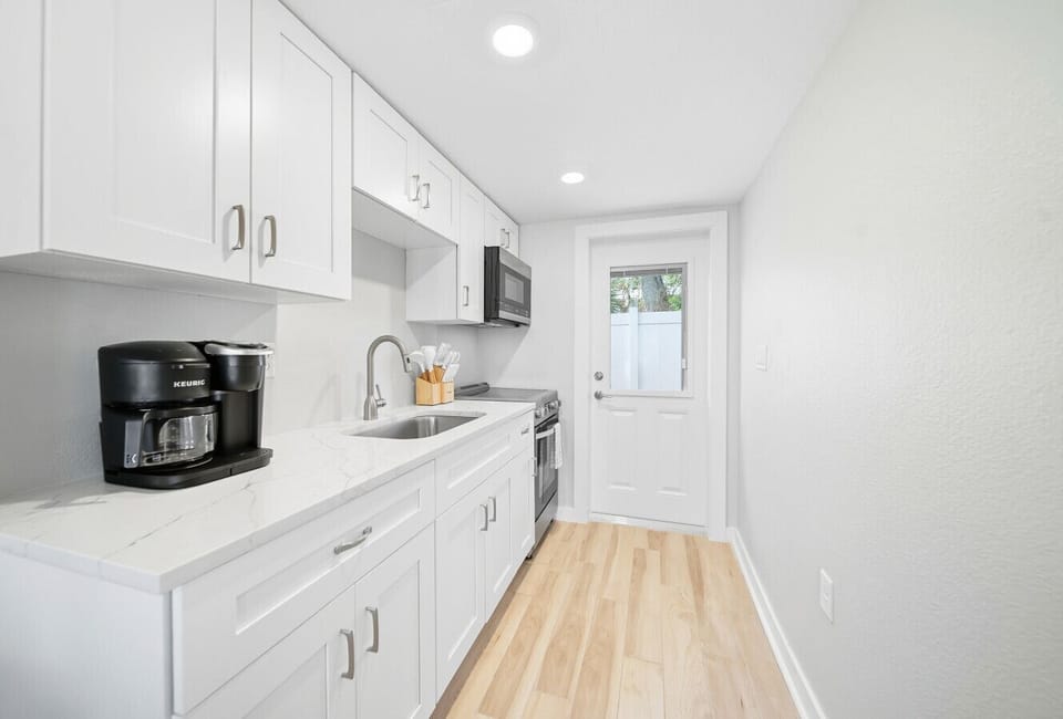 Kitchen with microwave, oven & stove