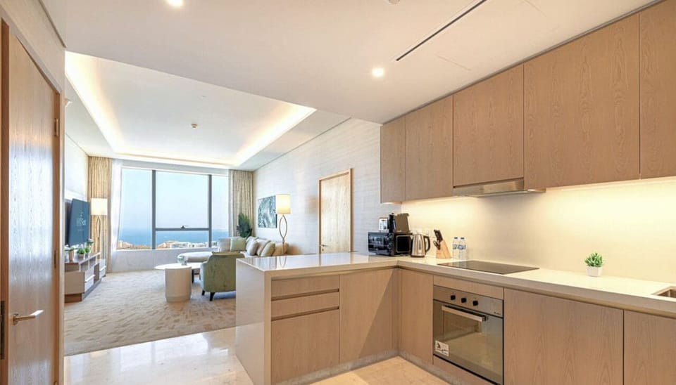 This modern kitchen blends luxury with functionality, featuring high-end appliances, elegant finishes, and stunning Palm Jumeirah views to inspire every meal.