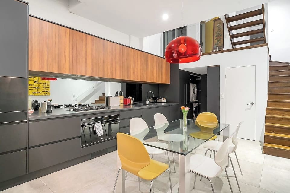 The kitchen features an extra wide oven, five-burner gas stove, rice cooker and a walk-in pantry area. 