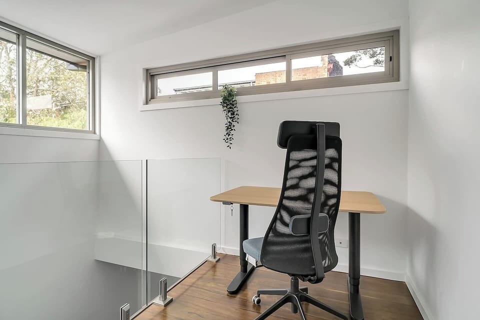 A dedicated workspace is located on the top level, where home workers can enjoy an electric sit-stand desk and ergonomic chair. 
