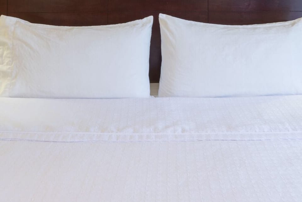 Sink into crisp linens and drift off in total comfort.