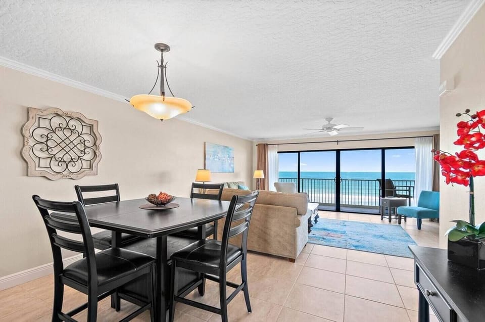 Comfortable dining area plus breakfast bar open to a modern kitchen.