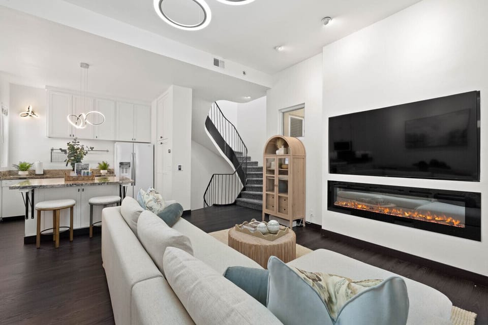 Stylish living room w/ TV, plush seating & a bright, open layout for unwinding.