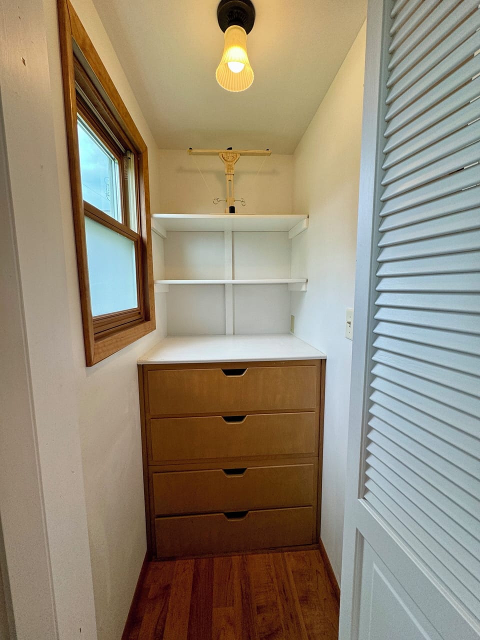 1st floor bedroom closet with built-in drawers