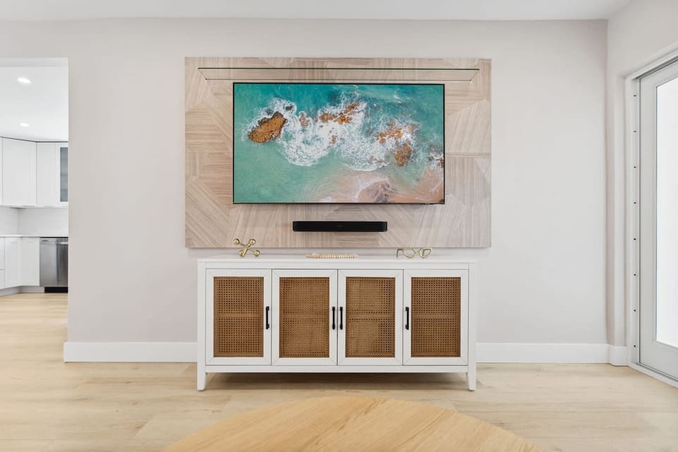 Entertainment at its finest! Immerse yourself in our living room oasis featuring a 65" Samsung smart TV and Sonos sound bar. Movie nights just got an upgrade.