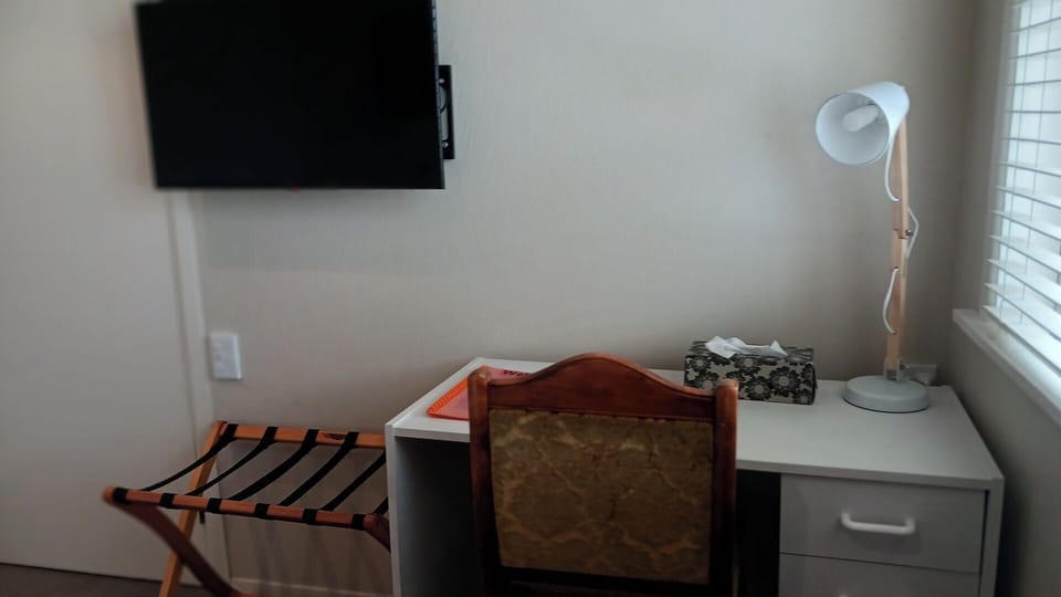 Smart TV & desk in bedroom 1