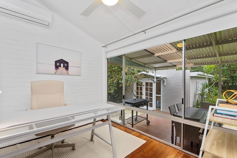 Your perfect spot for calm and clarity. This inviting area combines comfortable workspace with the serene feel of the outdoors.